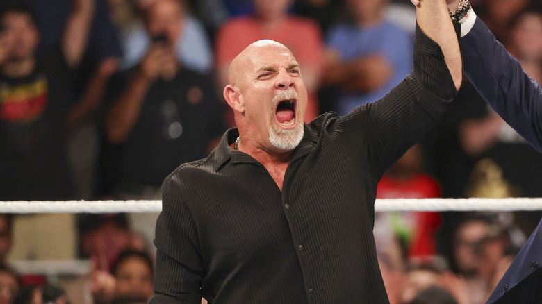 Bill Goldberg poses in the ring with Triple H during Bad Blood at State Farm Arena on October 5, 2024 in Atlanta, Georgia.