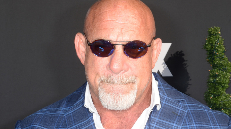 bill goldberg posing at press event