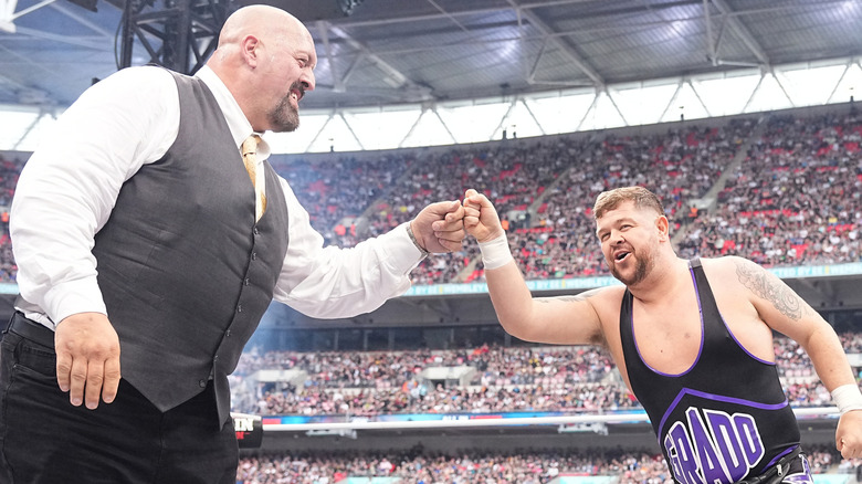 Grado and Paul Wight fist bump