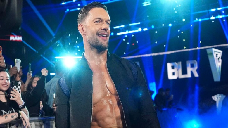 Finn Balor poses on the ramp during his entrance before a match on 