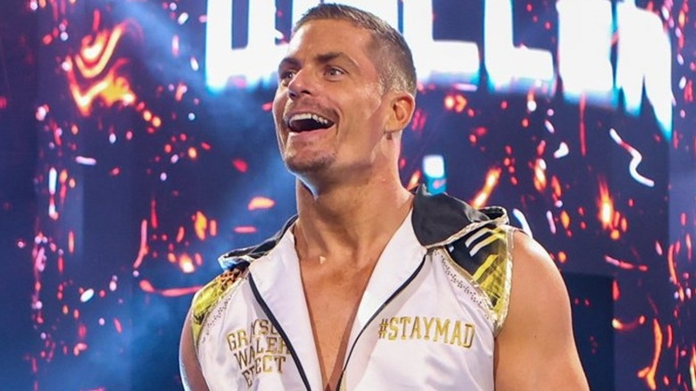 Grayson Waller walks to the ring