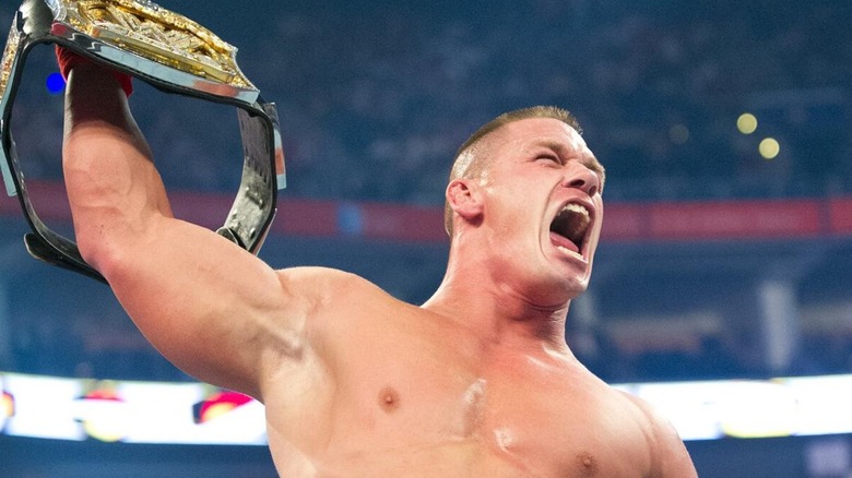 John Cena raising the WWE Championship