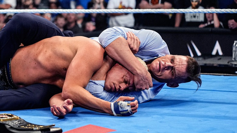 GUNTHER locking Cody Rhodes into a headlock after attacking him ahead of their Clash in Italy match.