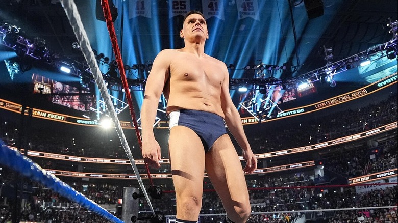 GUNTHER stands in the ring tall and mighty ahead of ending John Cena's in-ring career last December at WWE Saturday Night's Main Event