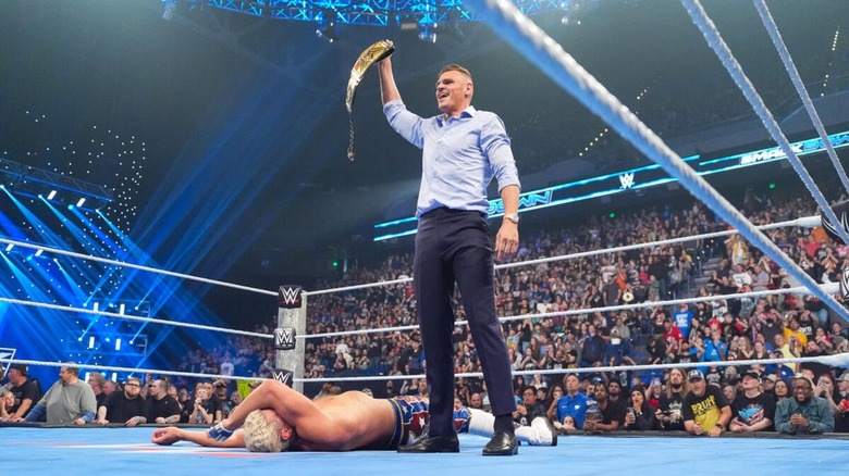 GUNTHER holds the Undisputed WWE Championship over a fallen Cody Rhodes in the ring to end an episode of 