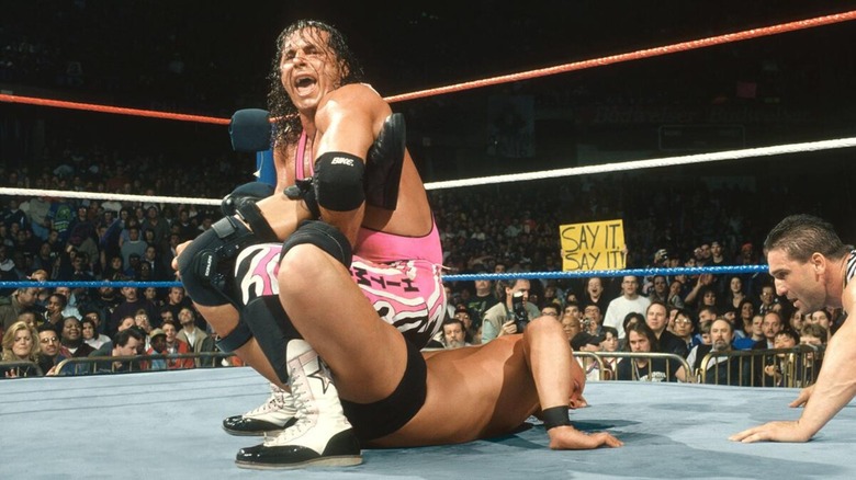 Bret Hart locking Stone Cold Steve Austin into The Sharpshooter at WrestleMania 13.
