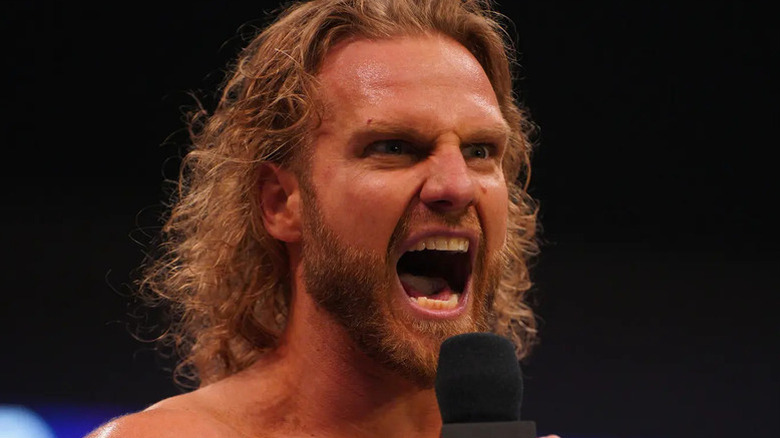 "Hangman" Adam Page shouting into a microphone