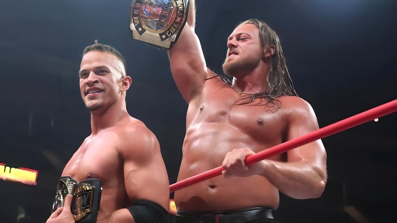 Ricky Starks and Big Bill pose with the AEW tag team championships