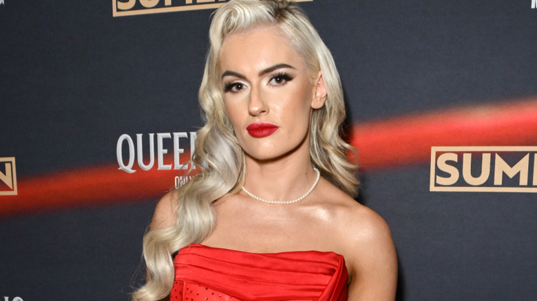 Blake Monroe wearing a red dress