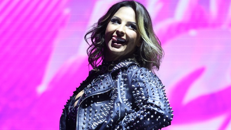 Harley Cameron posing at the top of the stage ahead of a match on 