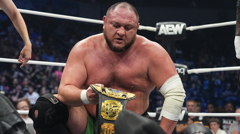 Samoa Joe looking at the AEW World Championship