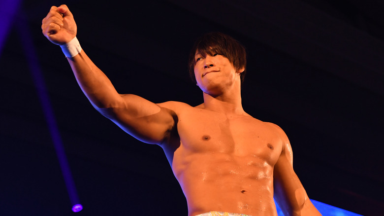 Kota Ibushi poses with his fist held high before a scheduled match