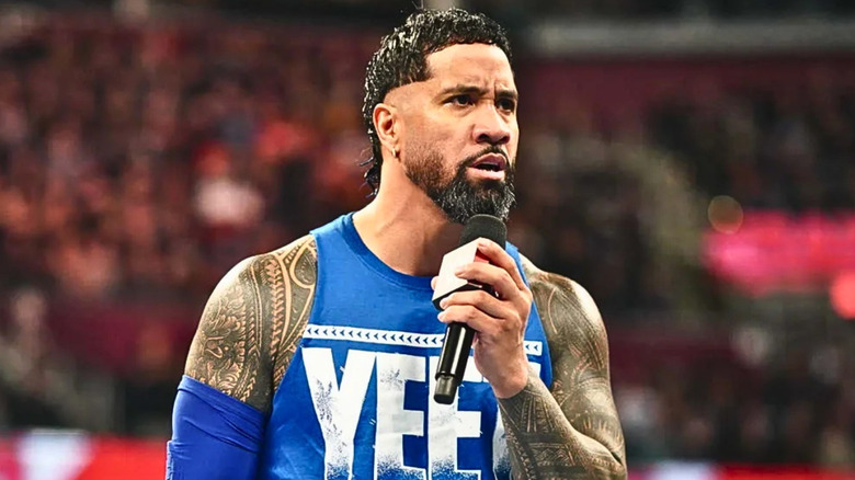 Jey Uso talking into a microphone