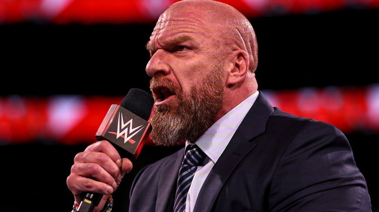 Triple H is fired up on the microphone