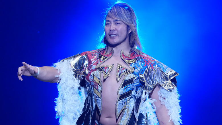 Hiroshi Tanahashi in his robe with blue backlighting