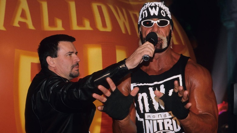 Eric Bischoff interviewing Hollywood Hogan during a segment on Halloween Havoc.