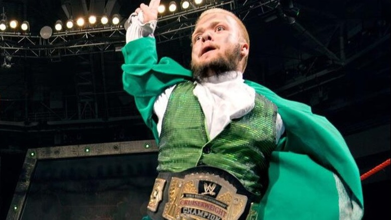 Hornswoggle proudly shows off his WWE Cruiserweight Championship in the ring