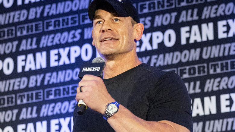 John Cena is holding a microphone