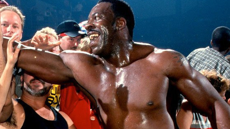 Booker T celebrates with fans