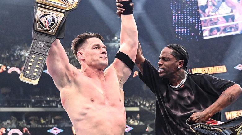 John Cena celebrates with Travis Scott at WrestleMania 41.