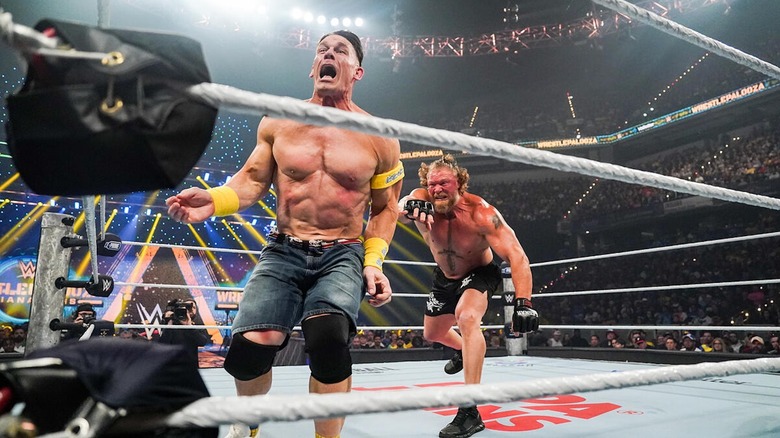 Brock Lesnar whips John Cena into the corner at Wrestlepalooza.