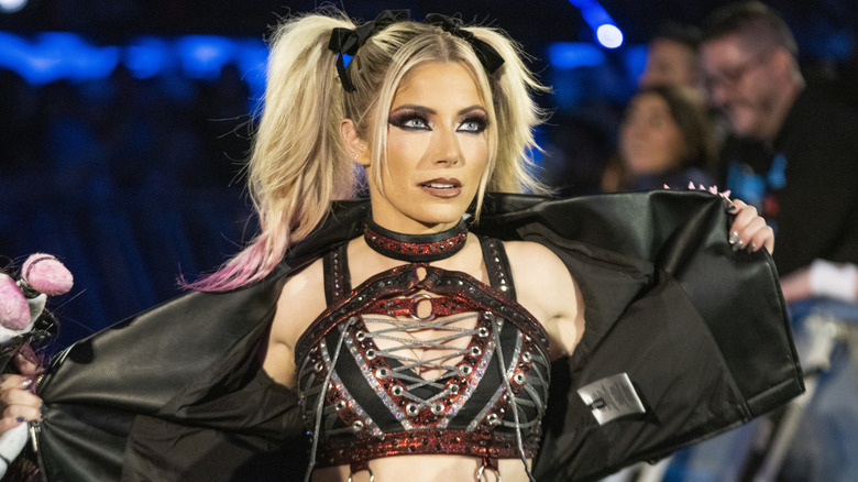 Alexa Bliss removing her jacket during WWE ring entrance