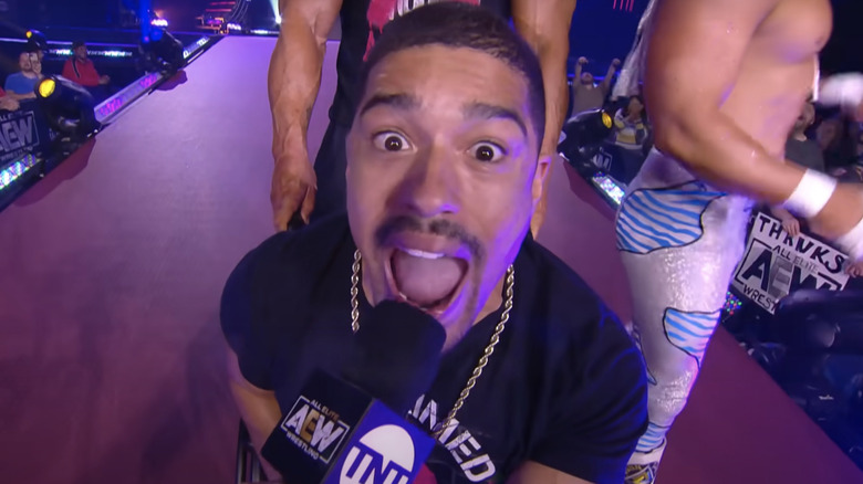 Anthony Bowens yells into a microphone
