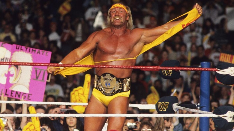 Hulk Hogan tears off his shirt to reveal the WWF Championship.