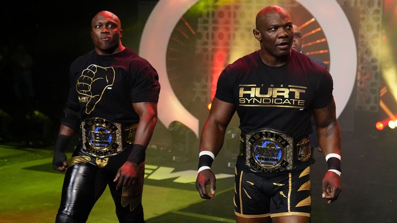Bobby Lashley and Shelton Benjamin make their entrances as the AEW World Tag Team Champions.