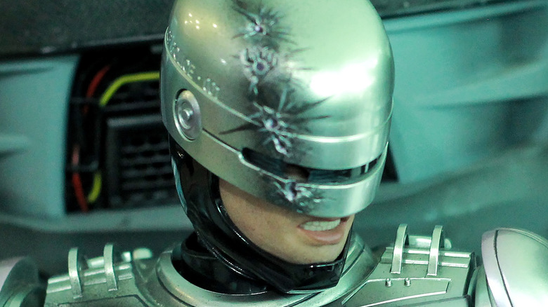 RoboCop standing, glaring