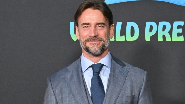 CM Punk is wearing a suit