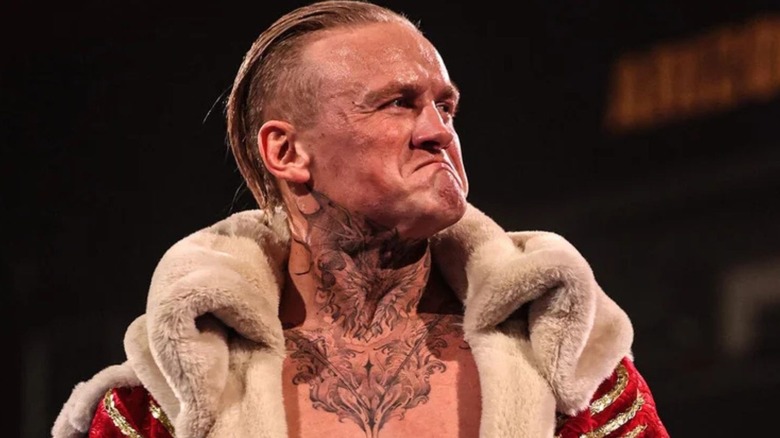 Ilja Dragunov looks toward the crowd, emotional, ahead of a match on WWE programming.