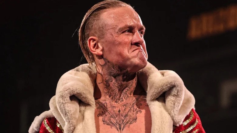 Ilja Dragunov looks toward the crowd, emotional, ahead of a match on WWE programming.