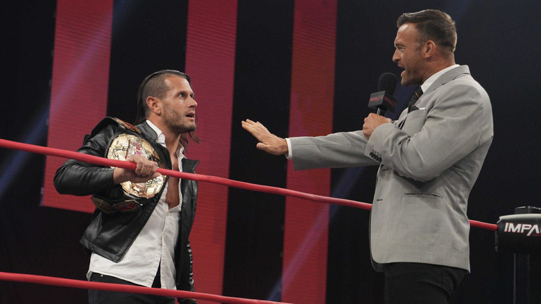 Nick Aldis talking to Alex Shelley