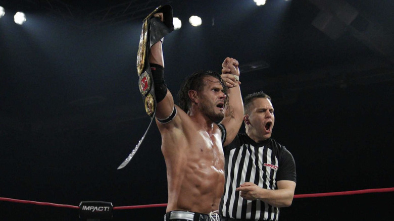 Alex Shelley celebrating