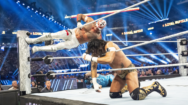 Rey Mysterio and Santos Escobar wrestling in a WWE event at Indiana, much bigger than local indie shows that take place there