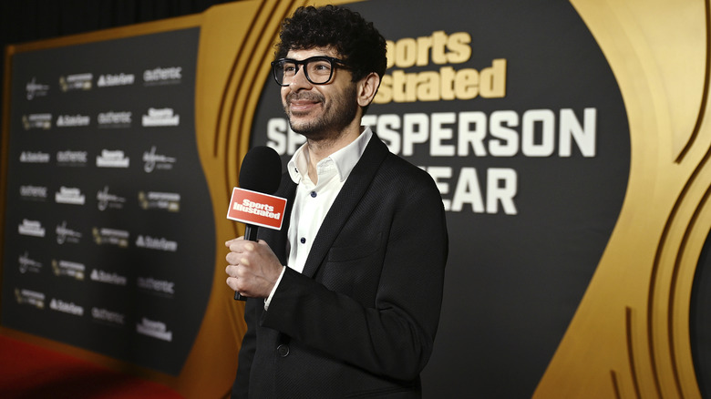 Tony Khan on the red carpet with a mic