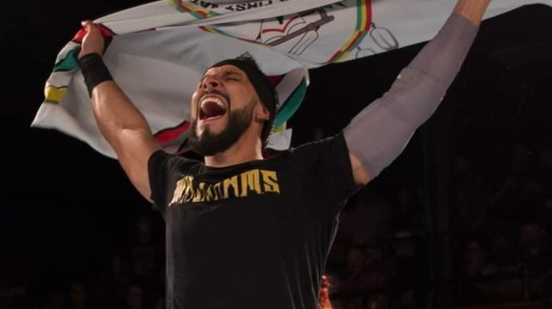 Sebastian Wolfe proudly holds the Pasqua Creed nation flag