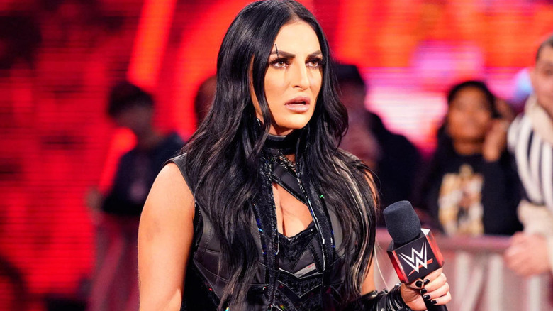 Sonya Deville holding a WWE microphone