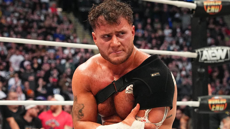 MJF holds his injured arm