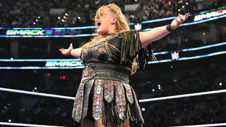 Piper Niven poses in the ring during a match on WWE programming.
