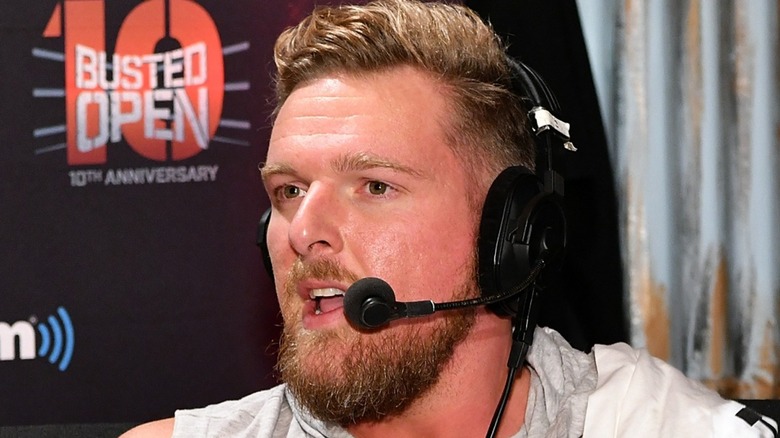 Pat McAfee speaking on a headset mic