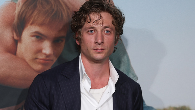 Jeremy Allen White wearing a navy blue jacket