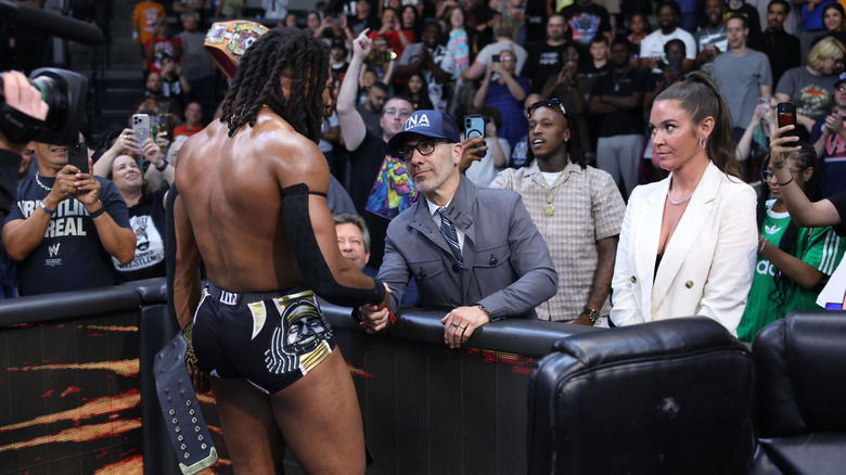 TNA Champion Trick Williams with some TNA executives