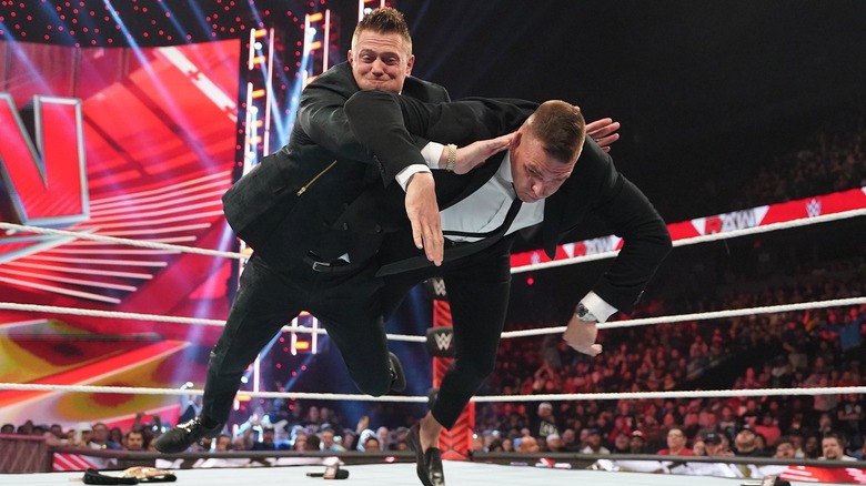 The Miz performing his finishing move on GUNTHER