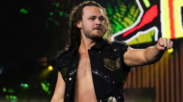 Jack Perry wearing a black vest jacket