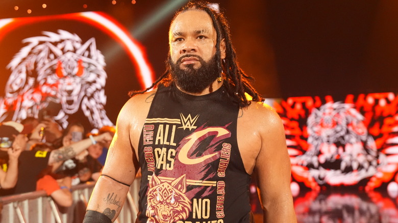 Jacob Fatu makes his entrance with a Fatu/Cavaliers collaboration tank top.