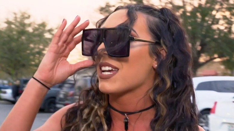 Jaycy Jayne during a promo segment in the parking lot.