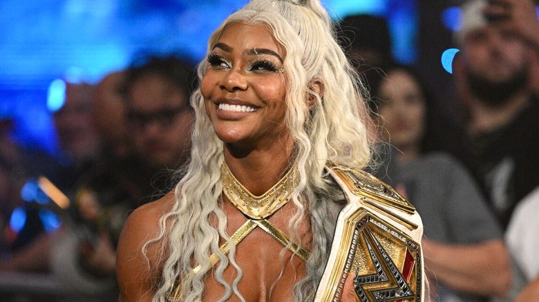 Jade Cargill, with her WWE Women's Championship on her shoulder, smiles on after a victory match on 