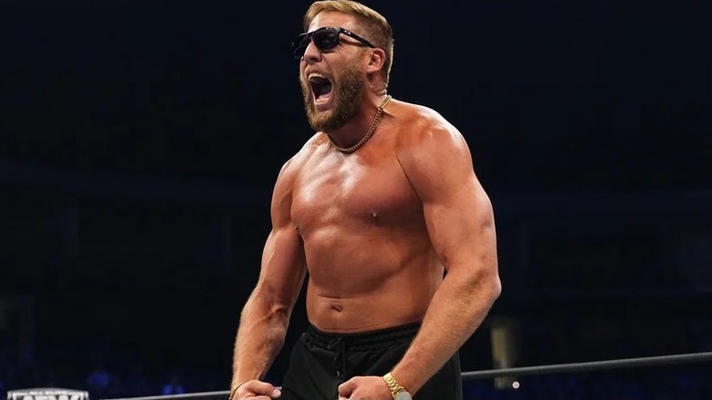 Former AEW star Jake Hager flexes his arms before a match